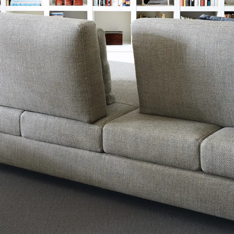 Elegant Swan Italia Hemingway sectional in neutral gray textured textile with a wooden frame and expanded polyurethane padding
