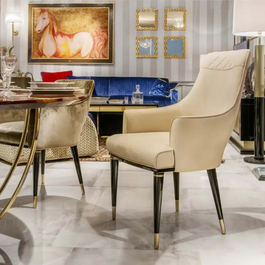 Exclusive Formitalia Dome armchair in light cream textile with quilted detailing and lacquered black legs with gold accents