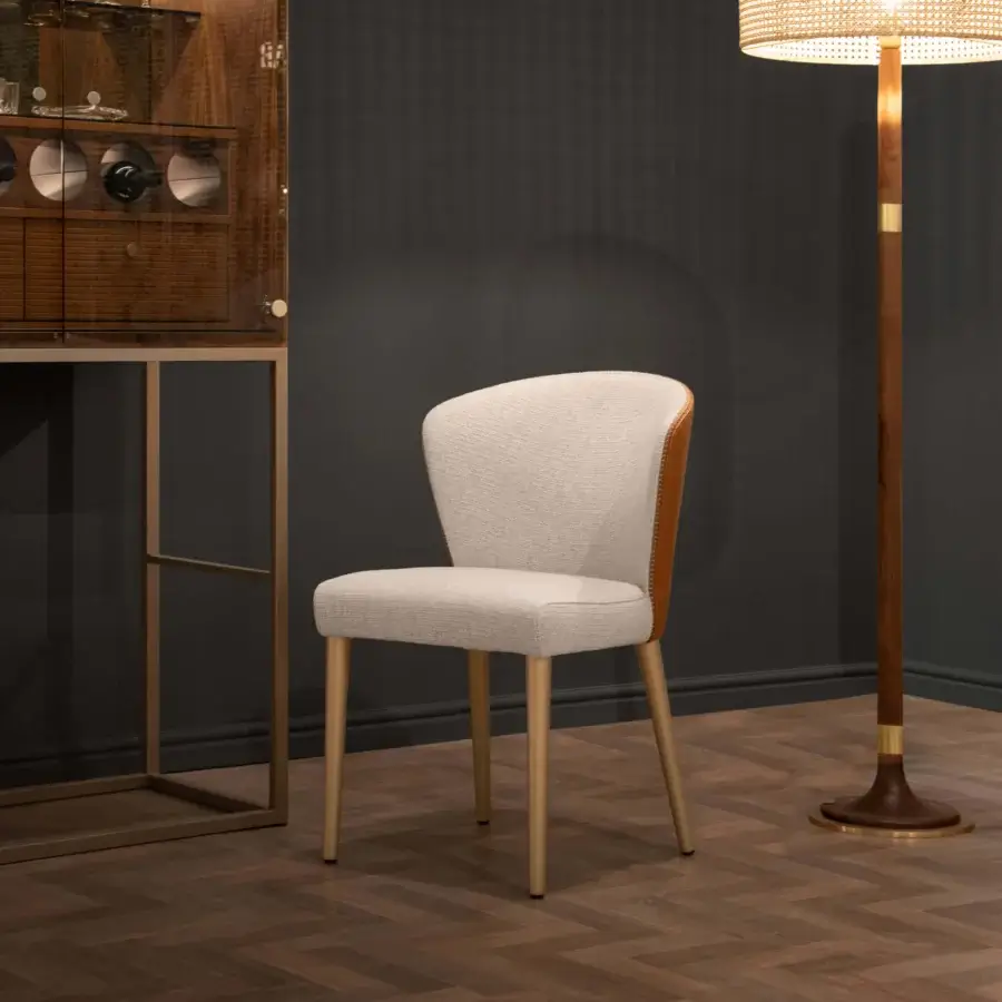 Elegant Formitalia Iside chair crafted in Italy with light fabric upholstery and golden-brown metallic lacquered legs