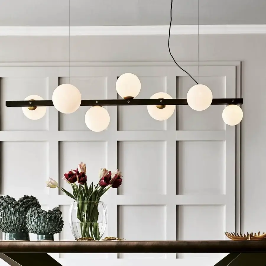 Refined Cattelan Italia Planeta suspension lamp with a burnished steel frame and satin white blown glass lampshades creating diffused light