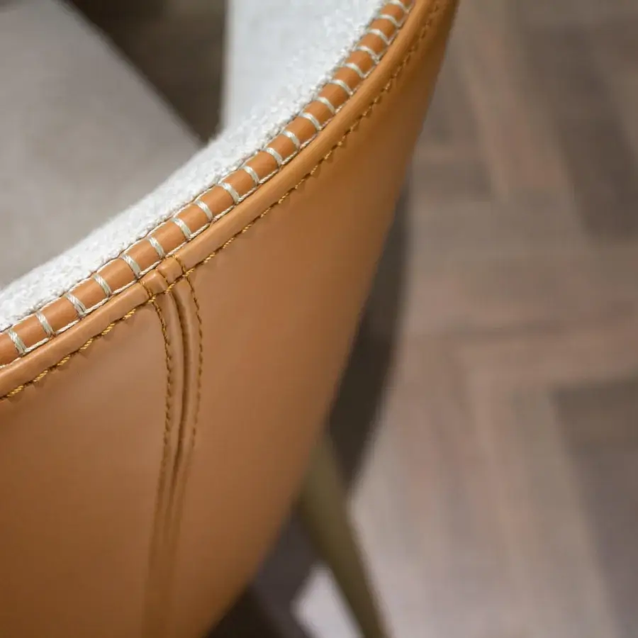 Exceptional Formitalia Iside chair crafted with light textile interior, light brown exterior, and metallic lacquered legs