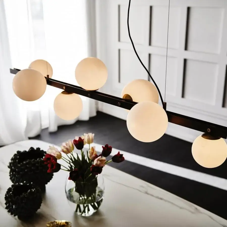 Distinguished Cattelan Italia Planeta suspension lamp with a burnished steel frame supporting satin white glass lampshades emitting warm light