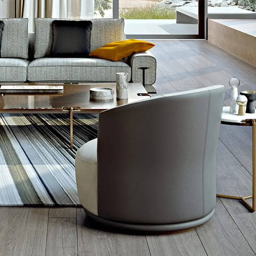 Exceptional Turri Blues lounge chair with a swivel base, light beige textile seat and smooth gray leather backrest