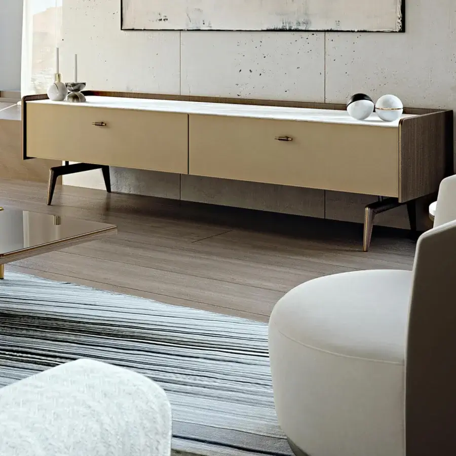 Distinguished Turri Blues lounge chair upholstered in light cream textile with a smooth finish and leather backrest