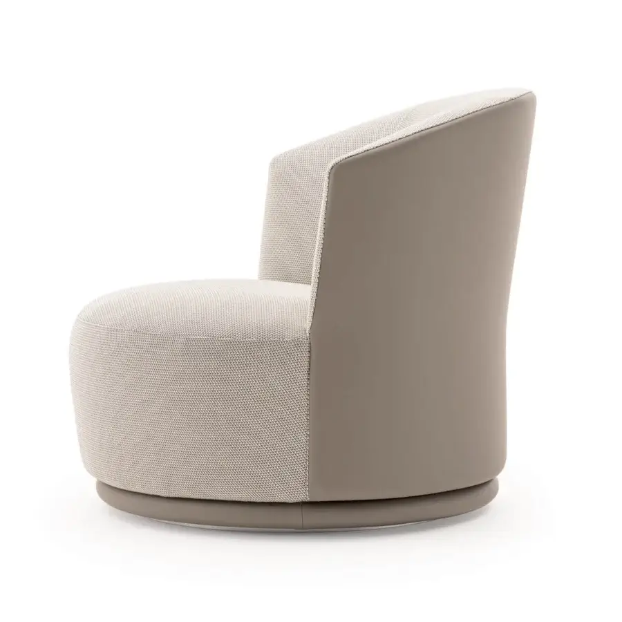Lavish Turri Blues lounge chair with a swivel base, light beige fabric interior and smooth matte taupe exterior with a leather backrest