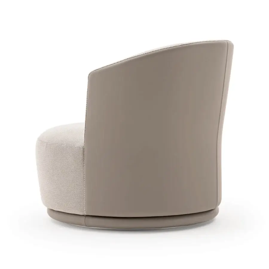 Exceptional Turri Blues lounge chair with curved form, taupe leather exterior and light beige woven textile interior