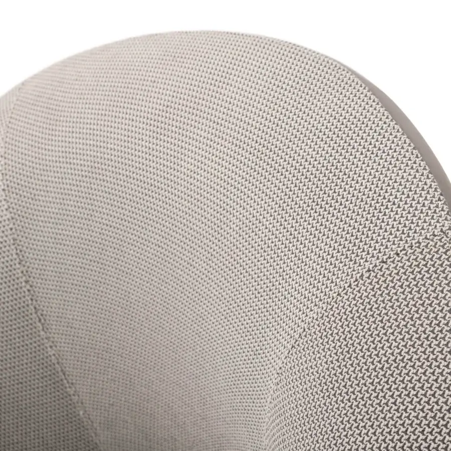 Elegant Turri Blues lounge chair upholstered in light gray woven textile with a curved silhouette and darker tone outlining
