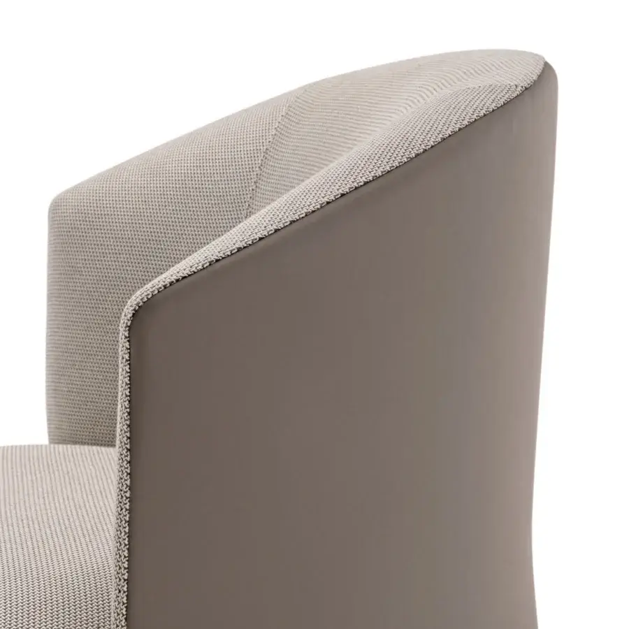 Exceptional Turri Blues lounge chair built with muted brown leather and light beige woven textile interior with a swivel base