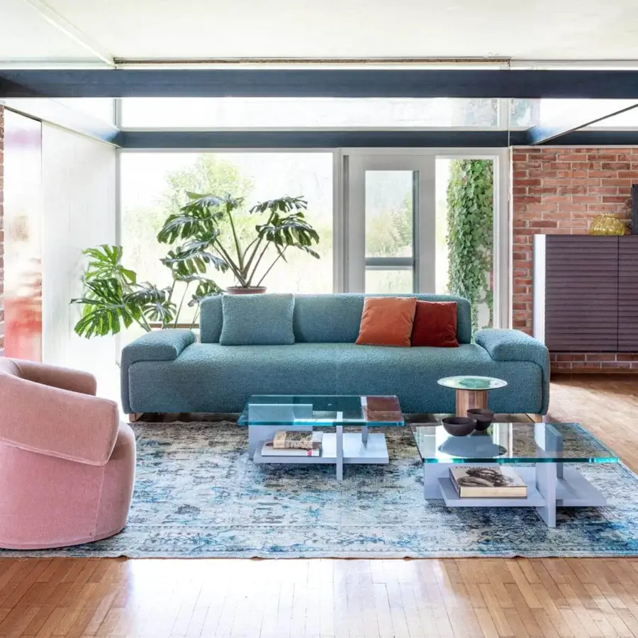 Harmonious Moroso Loveland sofa in muted teal-blue textile with ash wood varnished feet and terracotta suede-like cushions