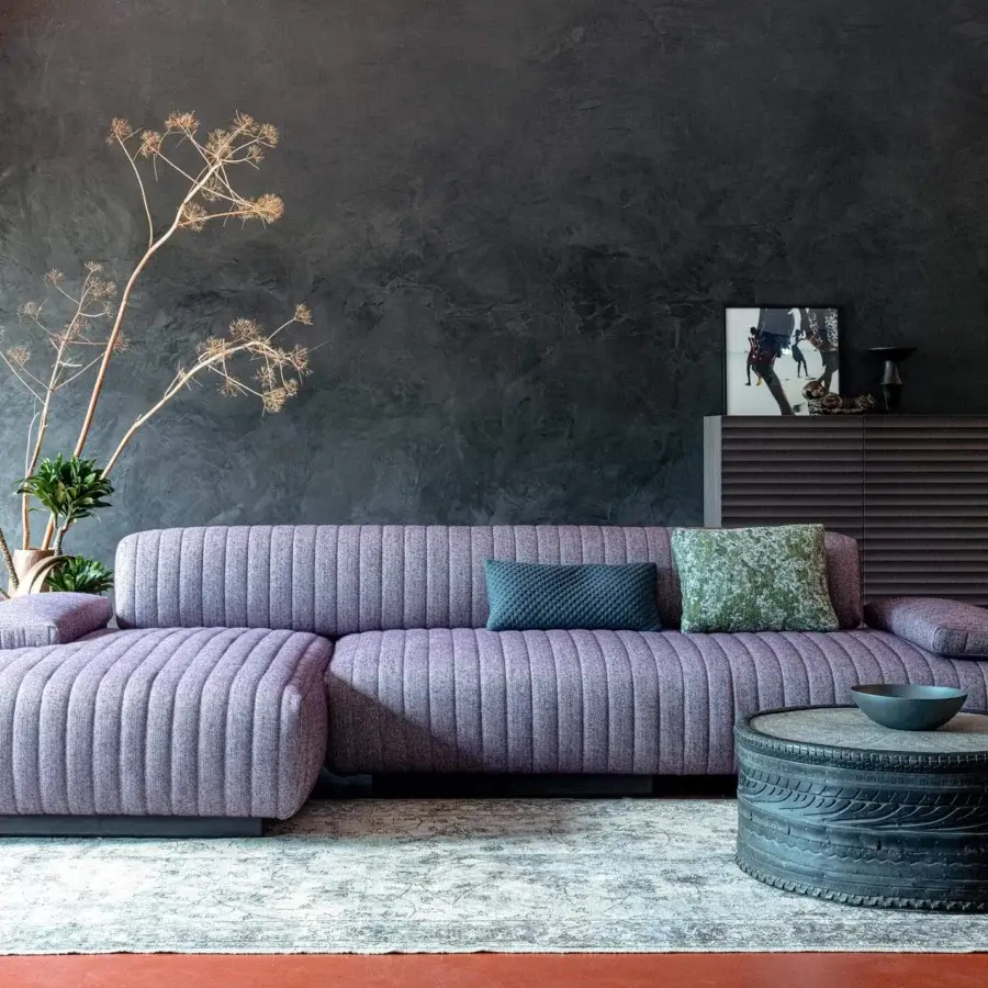 Exceptional Moroso Loveland sectional with lavender upholstery and luxurious quilting built with wood and ash feet