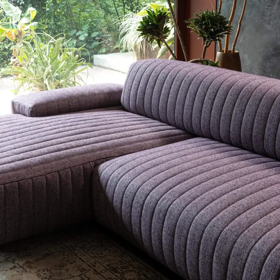 Elegant Moroso Loveland sectional in muted lavender textile with vertical channel detailing and ash wood varnished feet