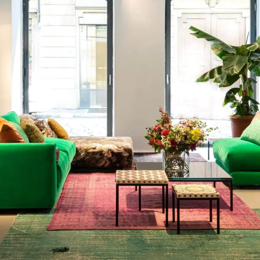Captivating Moroso Salon Nanà coffee table with polished laminated glass top and powder-coated steel base in RAL 9005