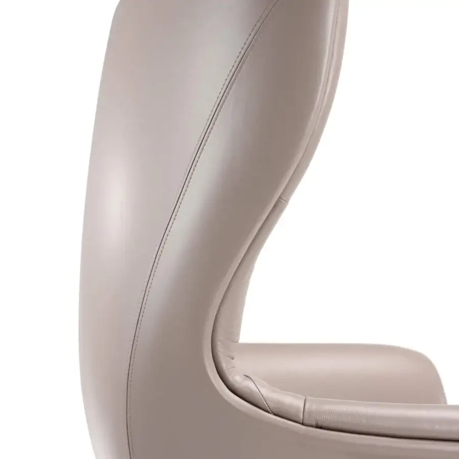 Lavish Turri Blues armchair with ergonomic seat and tall enveloping backrest upholstered in light taupe fabric