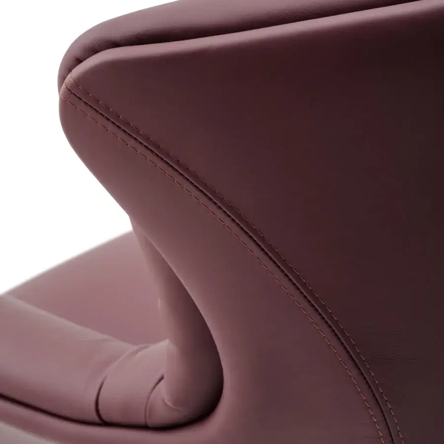Distinguished Turri Blues armchair with enveloping backrest upholstered in maroon Italian leather or fabric with subtle stitching