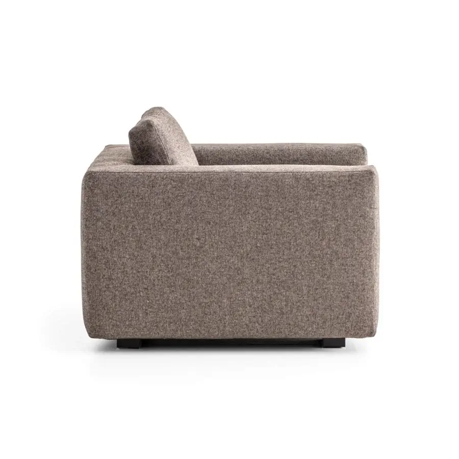 Sumptuous Moroso Salon Nanà lounge chair with warm brown textured textile and stained solid beech feet