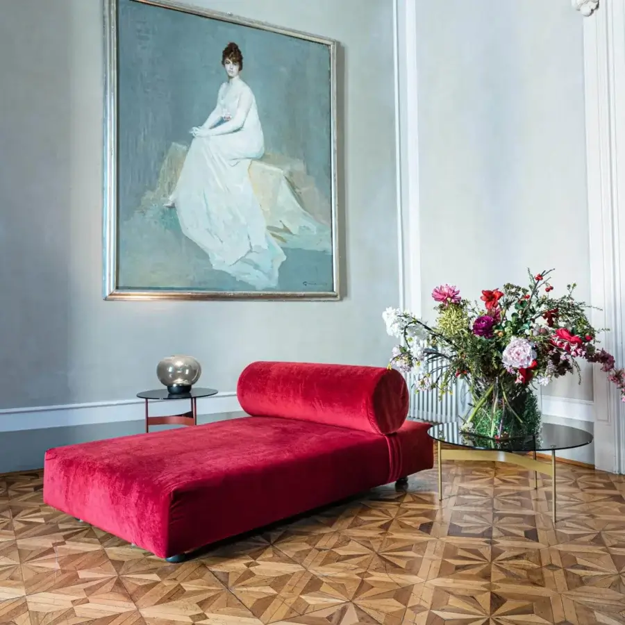 Elegant Moroso Salon Nanà chaise lounge with deep red velvet upholstery and turned stained beech feet