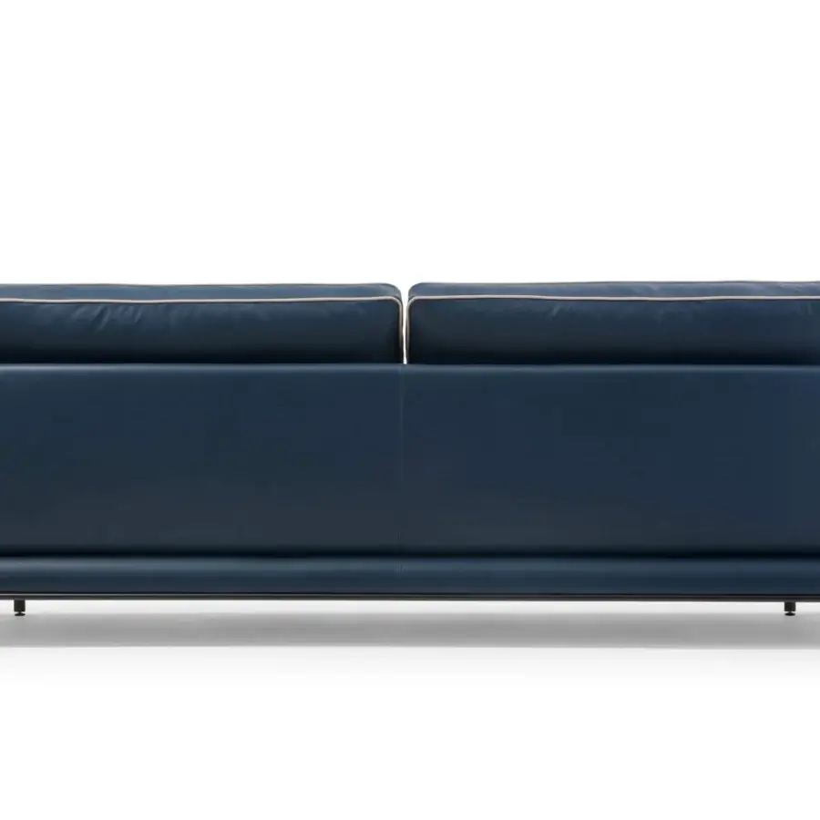 Sophisticated Turri Blues sofa with dark blue leather, linear walnut wood and sleek tubular metal legs presents inviting cushions with elegant piping