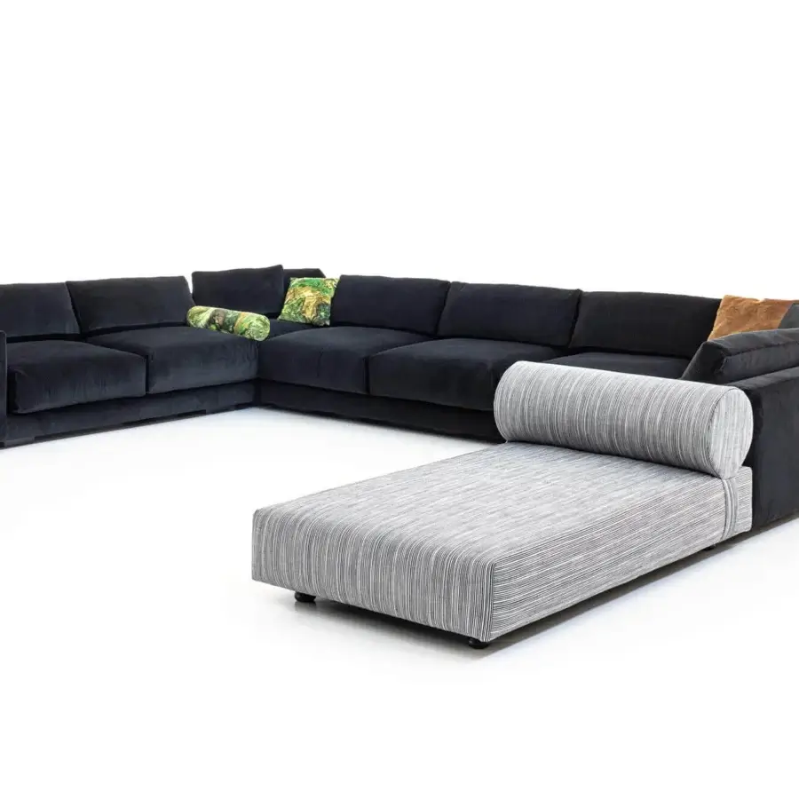 Captivating Moroso Salon Nanà sectional with dark textile upholstery, a chaise lounge in striped fabric and cylindrical pillow