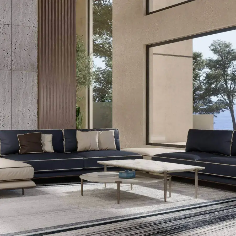 Elegant Turri Blues sectional with dark blue and beige leather upholstery, fine stitching, walnut wood, and tubular metal legs