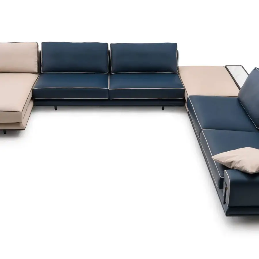 Elegant Turri Blues sectional in deep blue leather with beige piping and a rich walnut wood base built with tubular metal legs