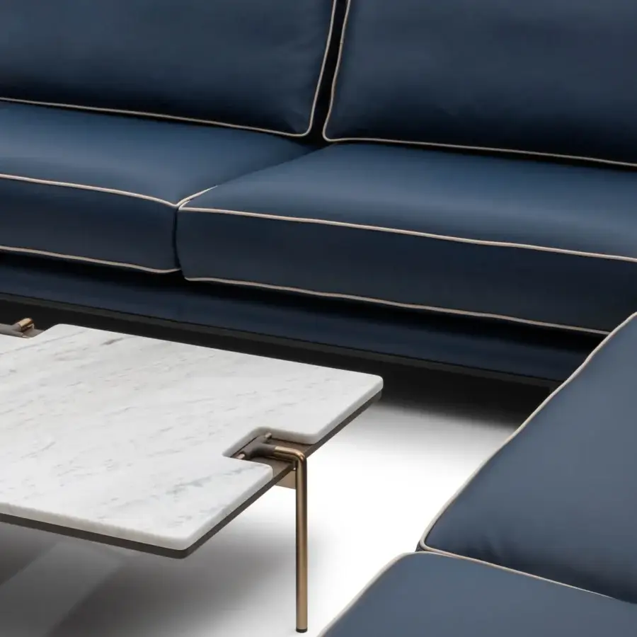 Superior Turri Blues sectional with smooth deep blue textile, lighter tone piping and linear walnut wood with tubular metal legs
