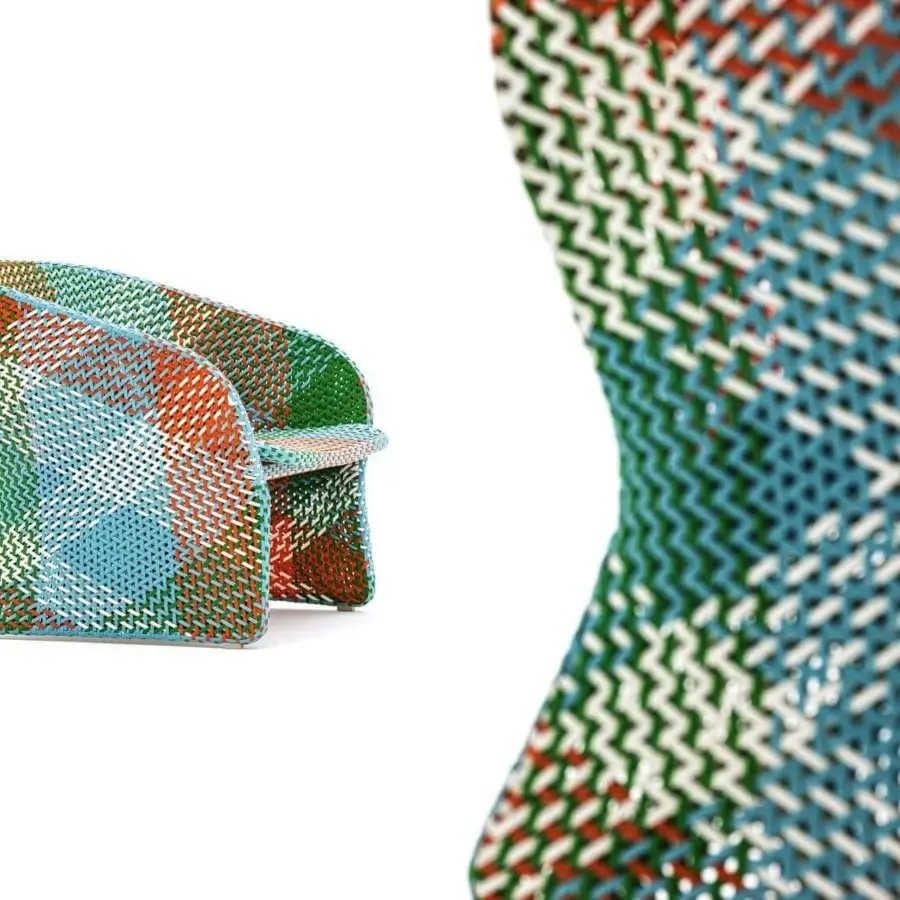 Refined Varaschin Maat lounge chair hand-woven in vibrant blue, green, orange, and white synthetic fiber with a powder-coated aluminum frame