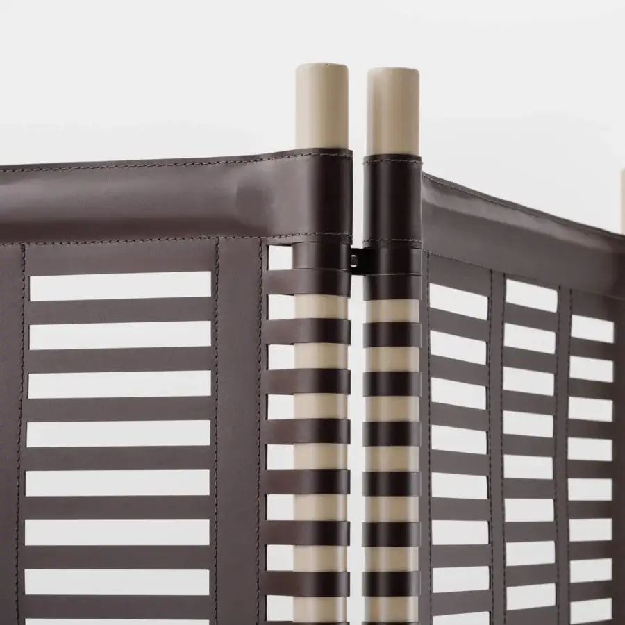 Distinguished Turri Blues room divider with horizontally arranged dark brown straps and light tan cylindrical supports