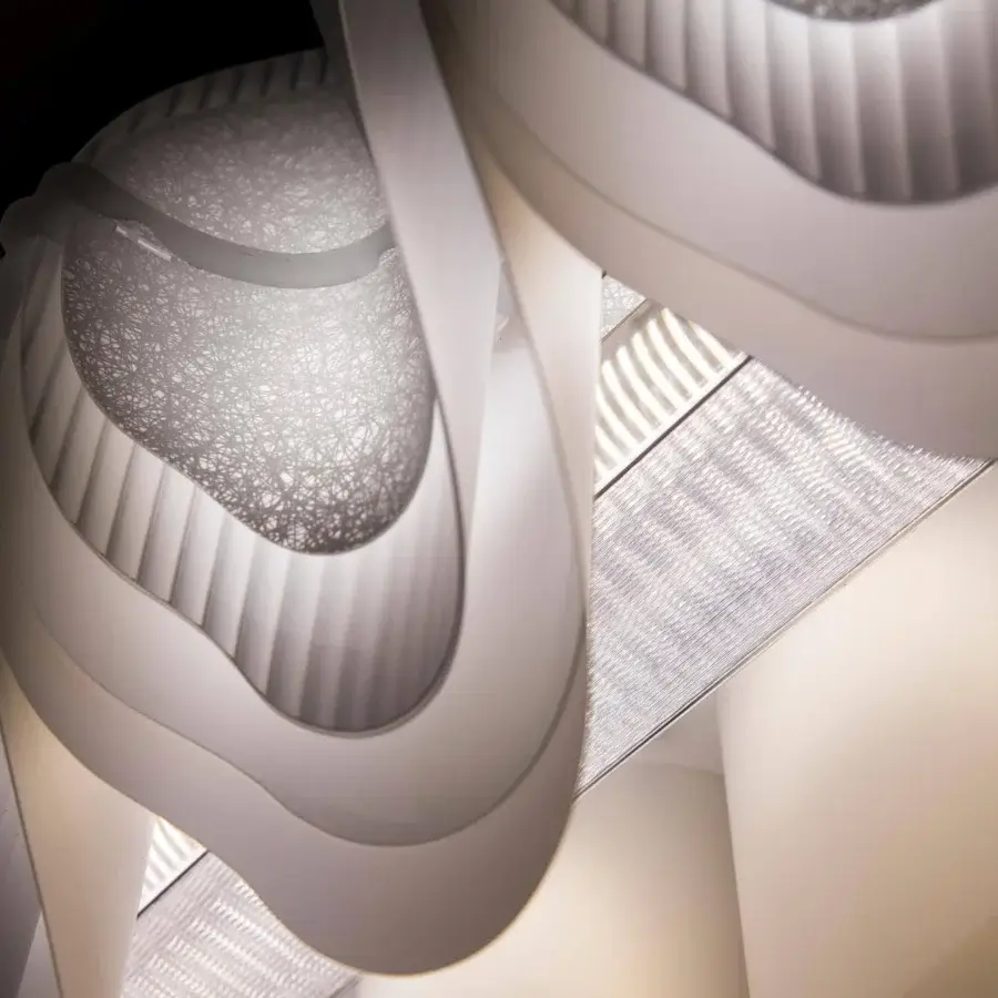 Elegant Slamp Fiordlys suspension lamp with layered shades crafted in crisp white Opalflex®, Lentiflex®, and Opalflex® material
