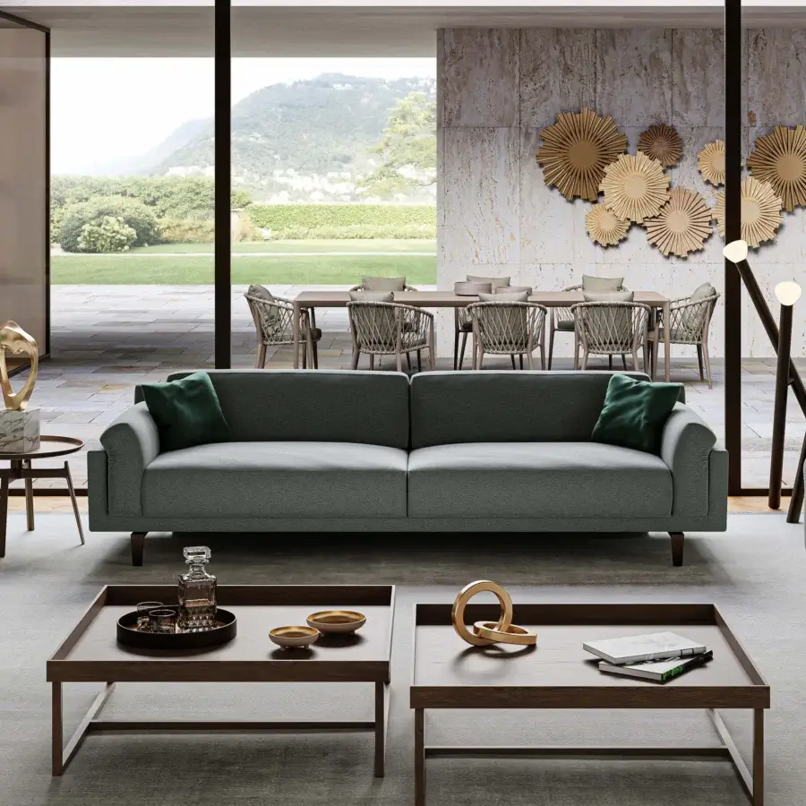 Distinguished Swan Italia Berry sofa with light grey textile upholstery, burnished metal feet and dark green feather cushions