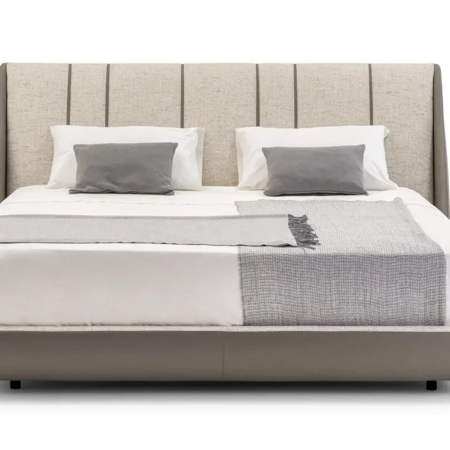 Elegant Turri Blues bed presents fully padded construction with leather and fabric upholstery, a matte gray base, and textured textile panels