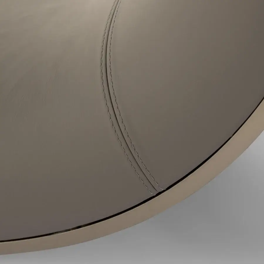 Superior Turri Soul table exhibits a serpentine leg with muted gray-beige smooth synthetic top and subtle detailed edge
