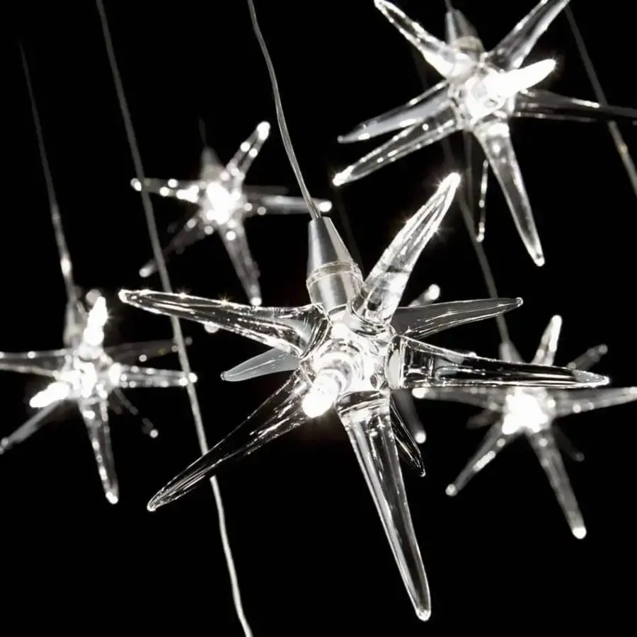 Superior Reflex Stella suspension lamp with transparent Pyrex glass stars and black glass support exhibiting a glossy finish