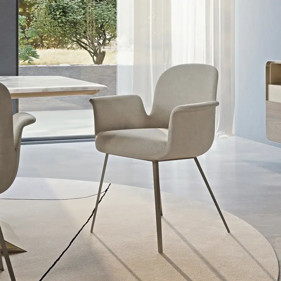 Distinguished Turri Soul armchair with light beige textile upholstery and inward-curving metal legs