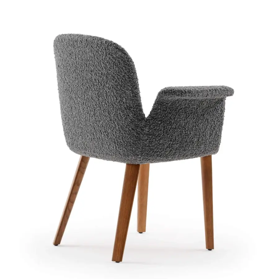 Exclusive Turri Soul armchair with enveloping ergonomic design in textured gray textile and tapered walnut wood legs