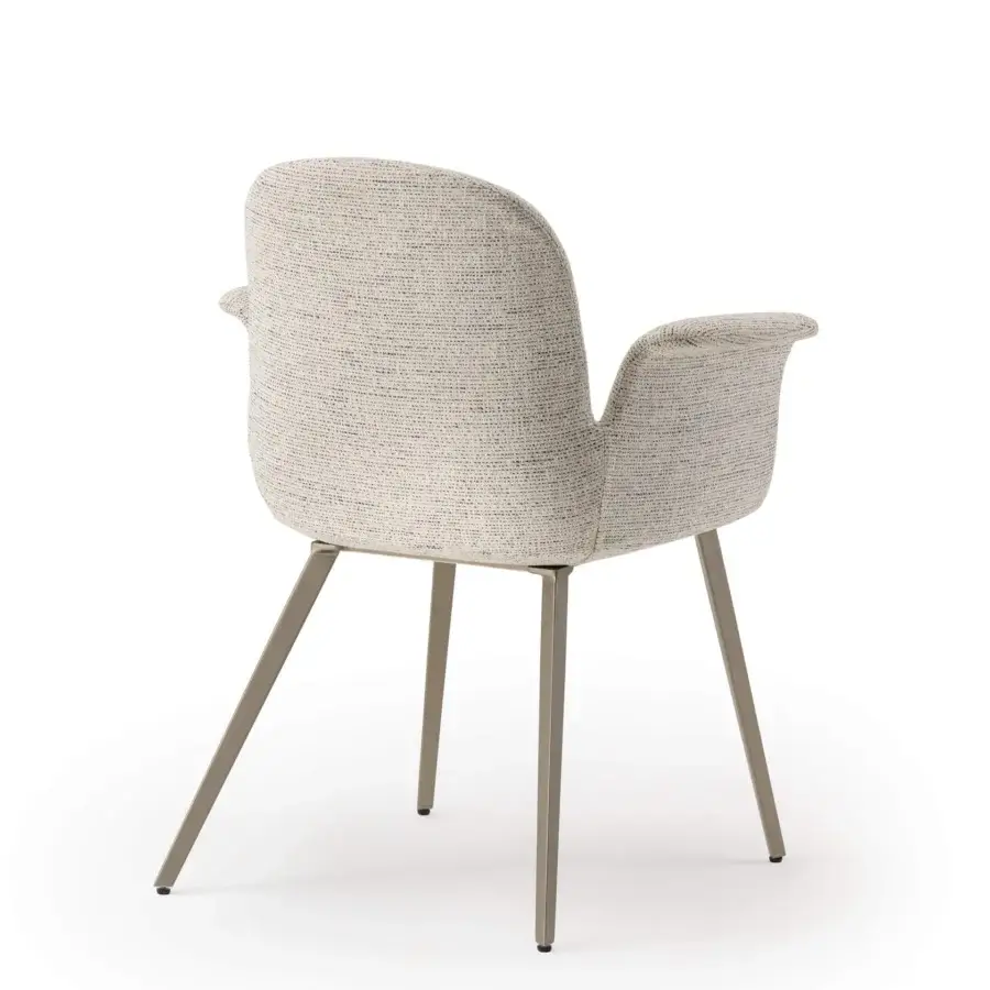 Lavish Turri Soul armchair with enveloping ergonomic design upholstered in light neutral textured woven fabric with matte light brown-grey metal legs