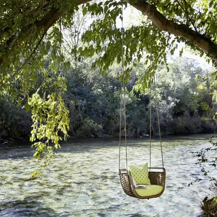 Exceptional Roberti Rattan Portofino swing crafted with aluminum and warm brown Nautic Rope with a plush green cushion