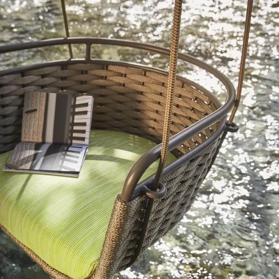 Distinguished Roberti Rattan Portofino swing built with aluminum and woven brown Nautic Rope, including a green cushioned seat