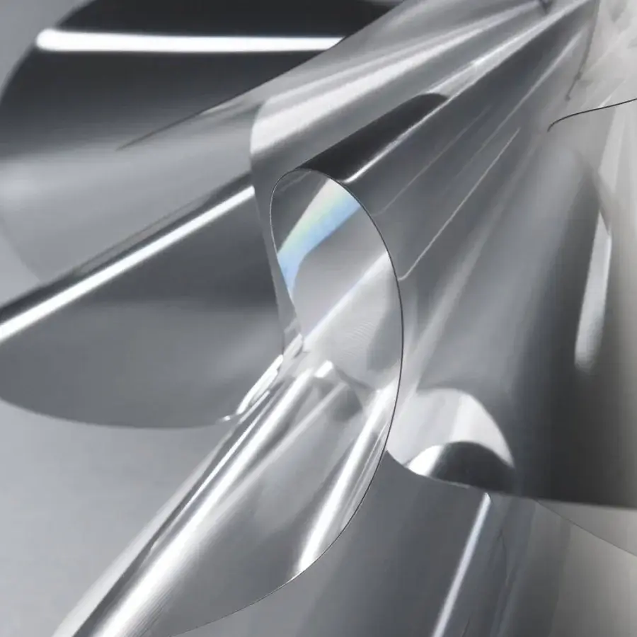 Superior Slamp Étoile lamp inspired by dance with swirling layered components in silver and iridescent Lentiflex® and a glossy finish
