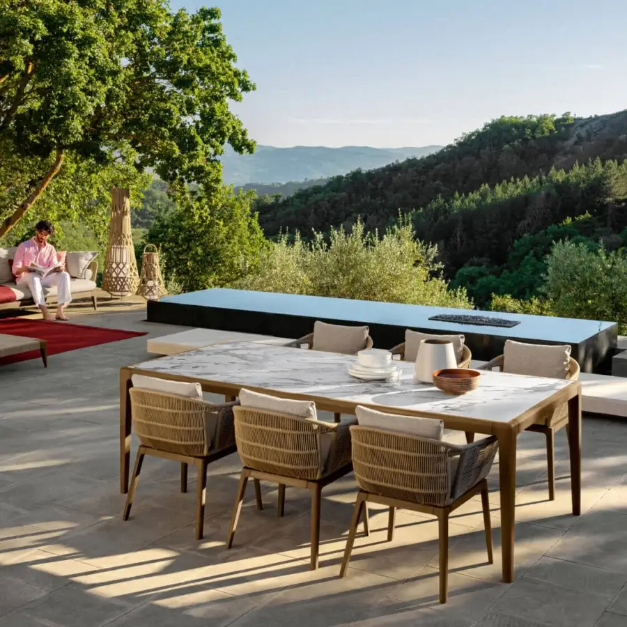 Distinguished Talenti Cruise armchair with teak wood structure and light-colored cushions crafted in woven rope detailing