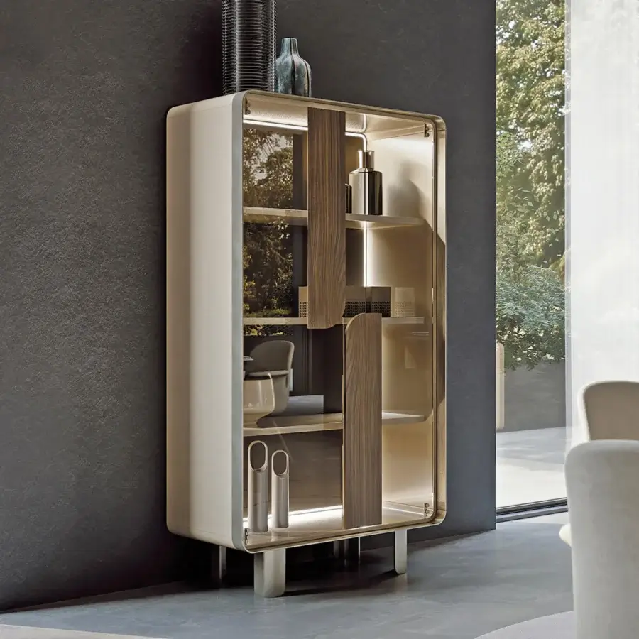 Distinguished Turri Soul cupboard with light cream lacquered wood and transparent glass doors showcasing wood applications within a metal frame