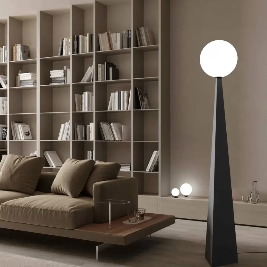 Elegant Stillux Glo floor lamp with a pyramid base in smooth steel and refined handmade blown glass lampshade with matte black finish