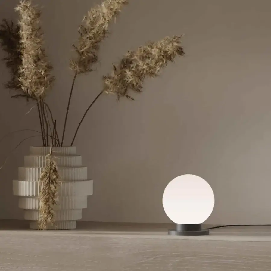 Exceptional Stillux Glo table lamp with spherical handmade matt white blown glass shade and circular matt black metal base