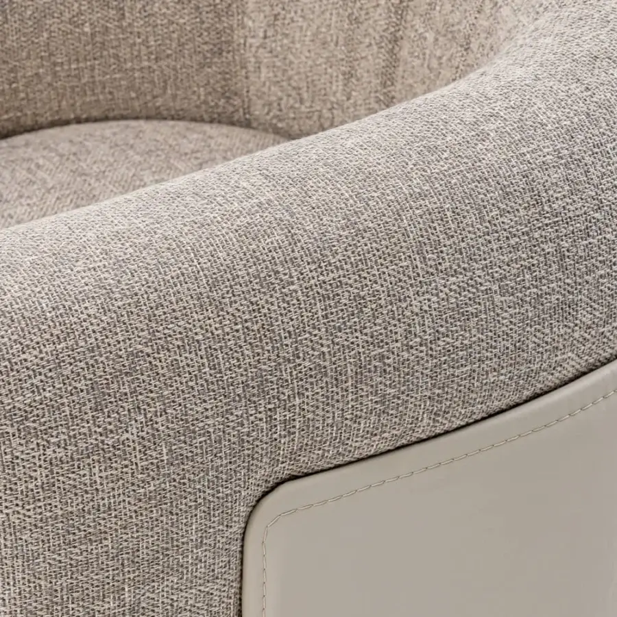 Superior Turri Soul lounge chair with gently curved armrests in textured light gray and beige woven textile with smooth gray accent