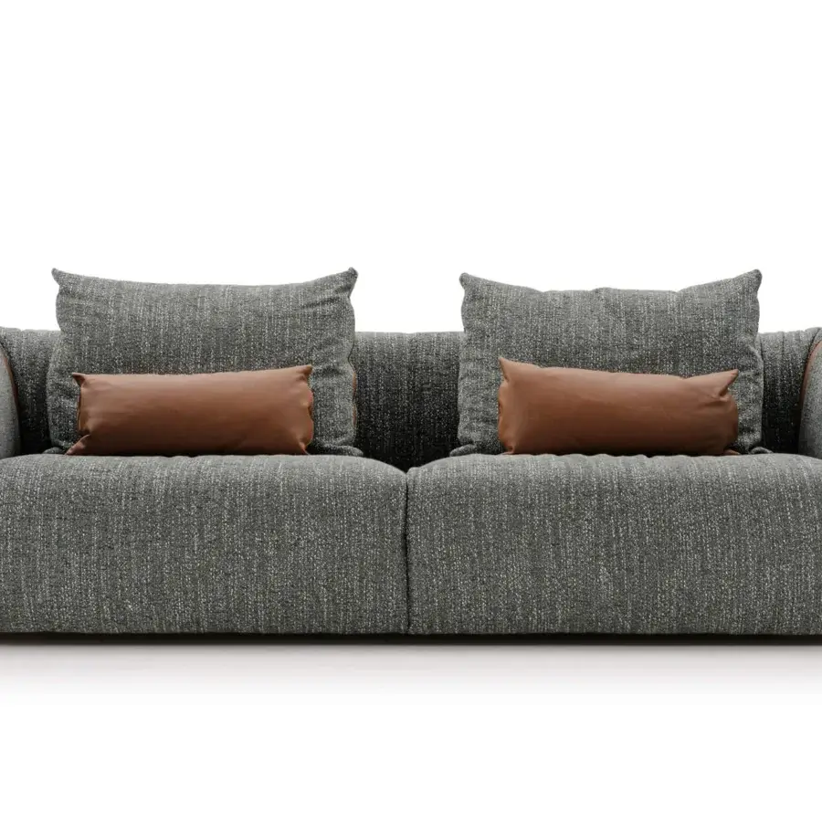 Distinguished Turri Soul sofa crafted in textured gray textile with smooth brown pillows and matching armrest accents