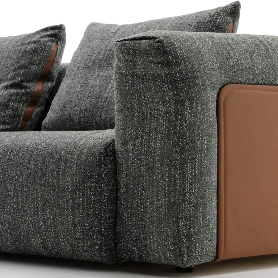 Superior Turri Soul sofa crafted in dark gray textile with warm brown leather panels and inserts