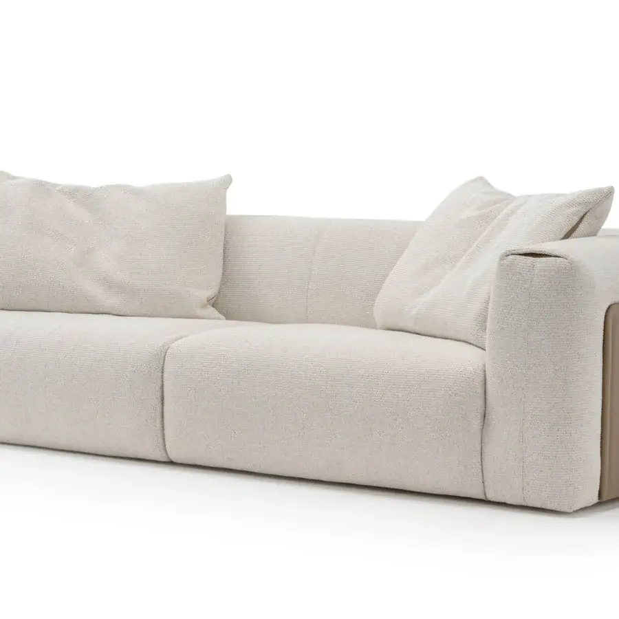 Exceptional Turri Soul sofa built with tan panels and light woven fabric, showcasing precious inserts enriching armrest edges