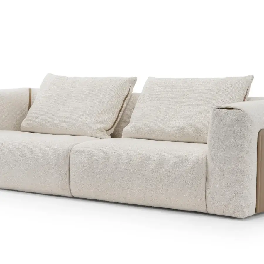Distinguished Turri Soul sofa built with tan panels and light beige textured textile, showcasing precious tan inserts