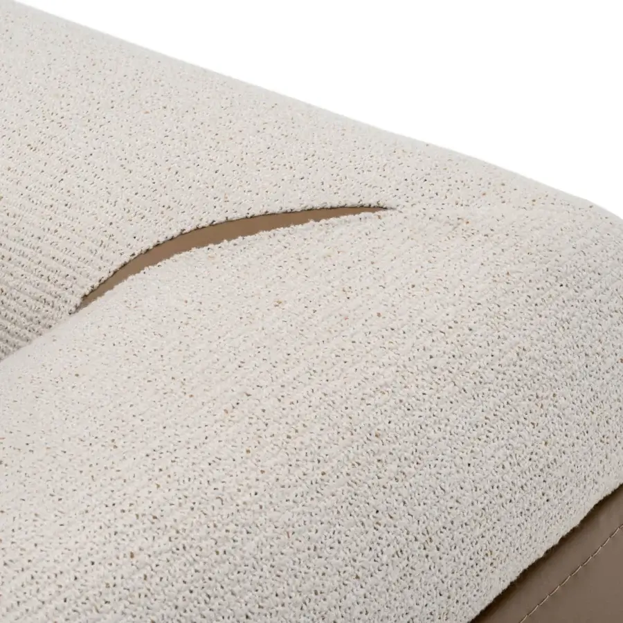Superior Turri Soul sofa exhibits a curved form built with light cream textile and smooth light brown inserts