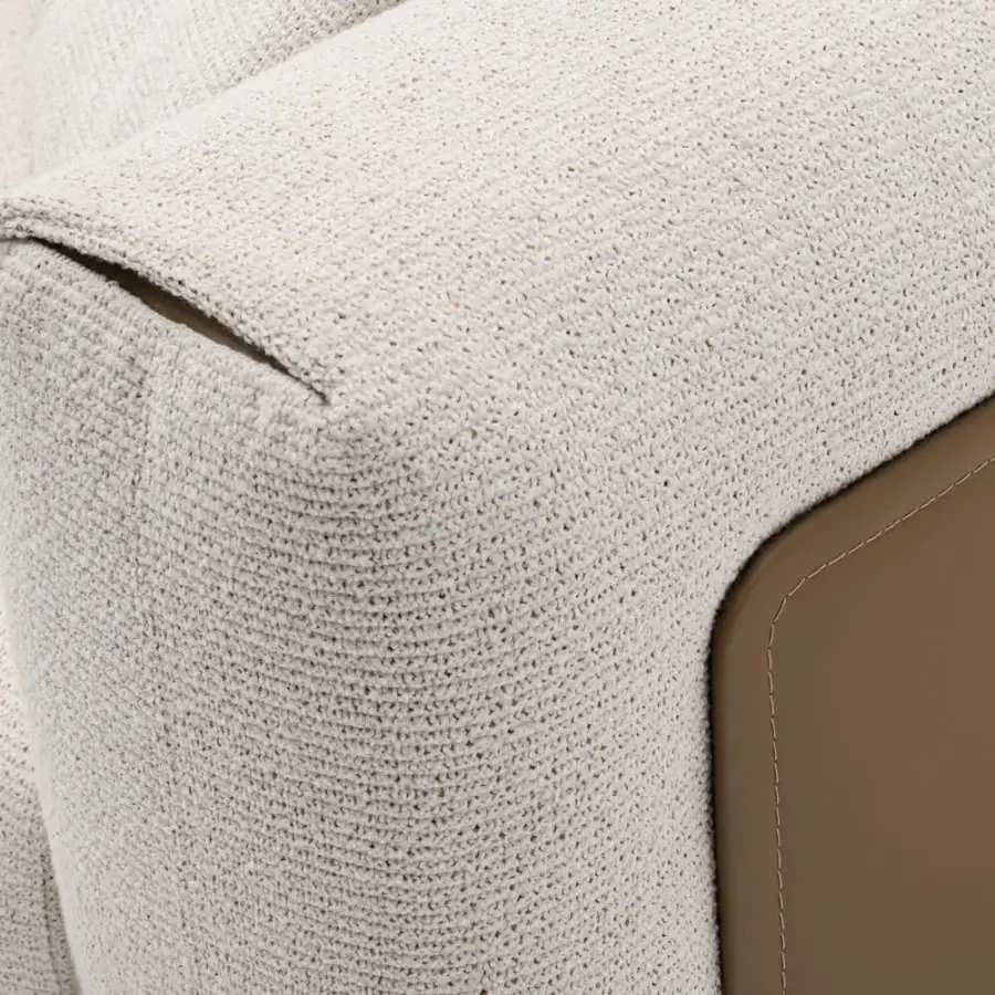 Distinguished Turri Soul sofa built with light beige textured textile and smooth brown side panels with precious inserts and matte finish