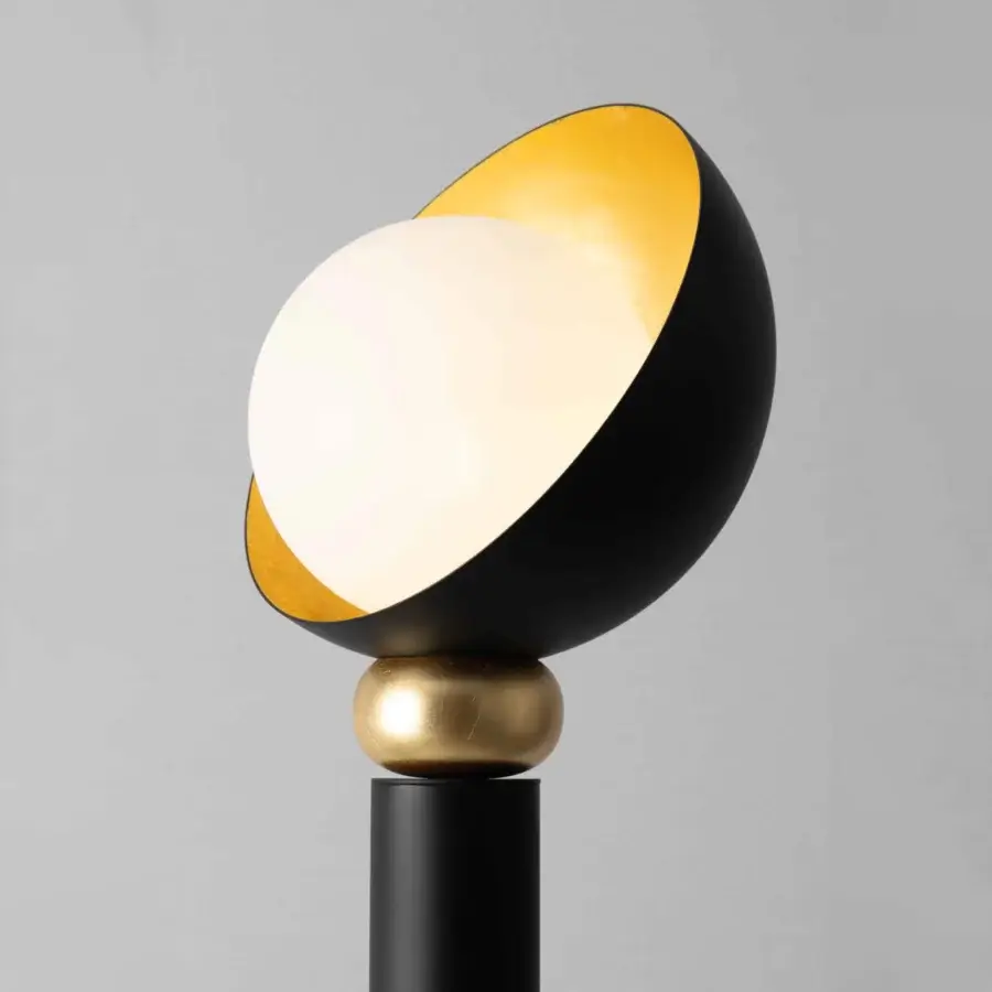 Distinguished Stillux Helo floor lamp with black metal tube supporting a matt white blown glass sphere and gold leaf finish